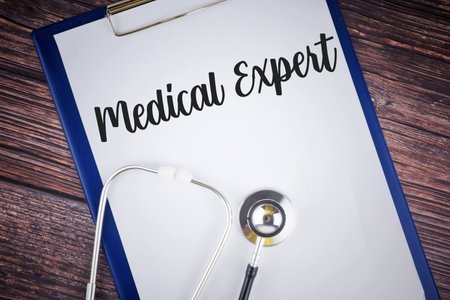 Selective focus image of stethoscope with Medical Fraud wording on a wooden background. Medical conceptの写真素材