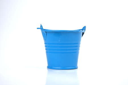 Selective focus image of clock, spectacles and notebook on a white background with copy space. Conceptual photoの写真素材