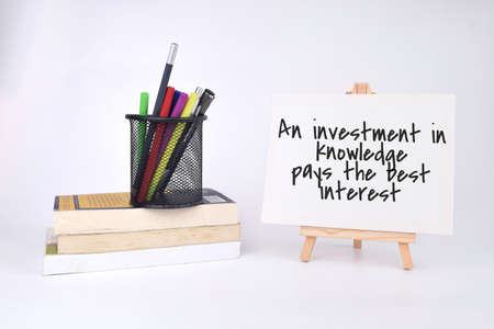 Selective focus image of trolley cart and bank note with economy quote on a white board. Economy conceptの写真素材