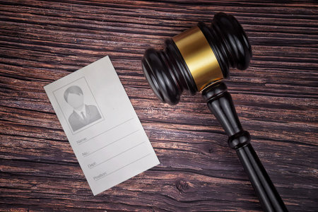 Selective focus image of gavel isolated over a wooden background. Law concept