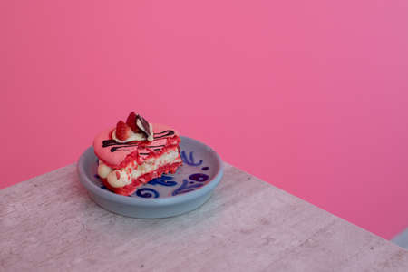 pink macarons stuffed with cream and strawberries. pastel colors, pink backgroundの写真素材
