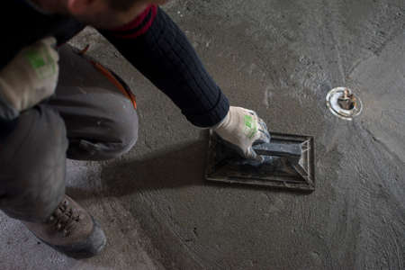 worker concludes edge of the concrete surfaceの写真素材