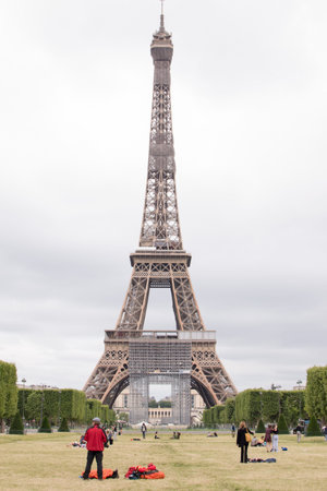 Paris, France, June 06, 2020: the Eiffel Tower in Paris and tourists, Famous landmark.
