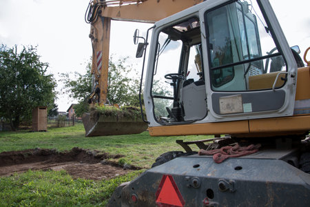 demarcation of a new building on topsoil before the construction of a family house begins, heavy...
