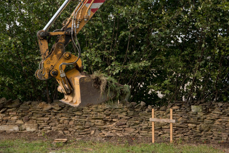 demarcation of a new building on topsoil before the construction of a family house begins, heavy...