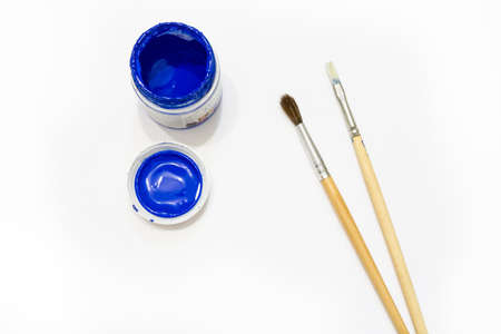 Blue paint with brushesの写真素材