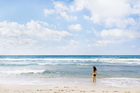 Girl on ocean beachの写真素材