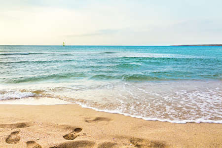 footsteps on a sand beachの写真素材