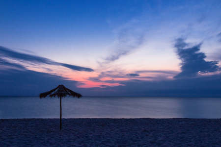 Beach umbrella on a sandの写真素材