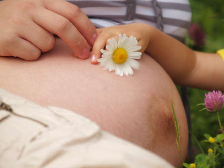 Close-up of pregnant woman bellyの写真素材