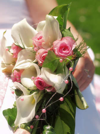 still life with wedding bouquet and wedding ringsの写真素材