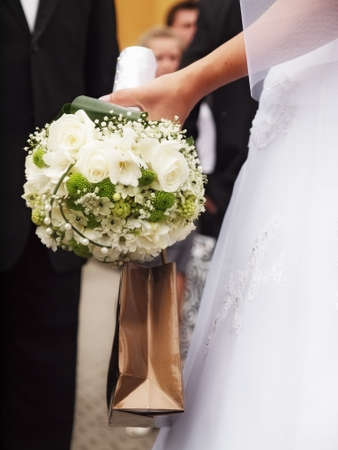 still life with wedding bouquet and wedding ringsの写真素材