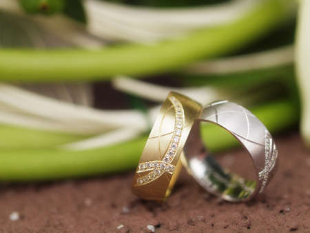 still life with wedding bouquet and wedding ringsの写真素材