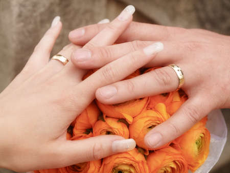 still life with wedding bouquet and wedding ringsの写真素材