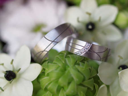 still life with wedding bouquet and wedding ringsの写真素材