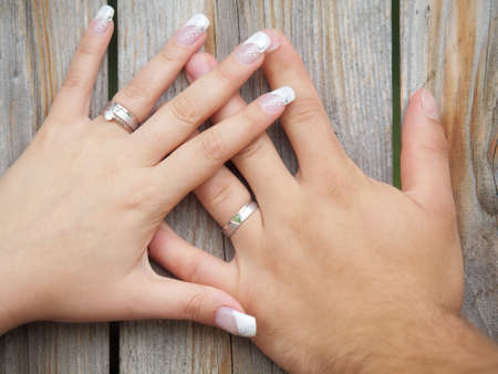 still life two hands with wedding ringsの写真素材