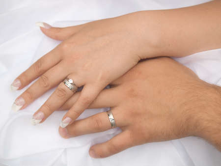 still life two hands with wedding ringsの写真素材
