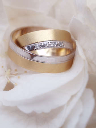 still life with wedding bouquet and wedding ringsの写真素材