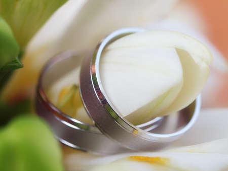still life with wedding bouquet and wedding ringsの写真素材