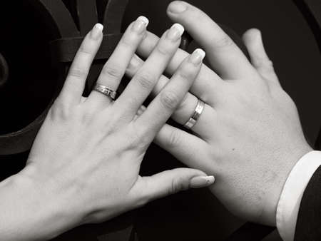 still life two hands with wedding ringsの写真素材