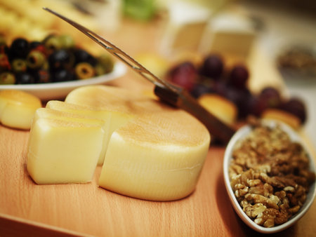 still life witch cheese, nuts and olives