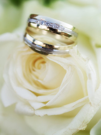 still life with wedding bouquet and wedding ringsの写真素材