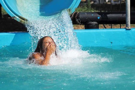 Little girl playing in a water parkの写真素材