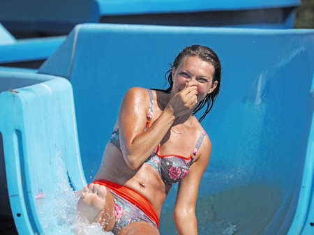 Adult woman playing in a water parkの写真素材