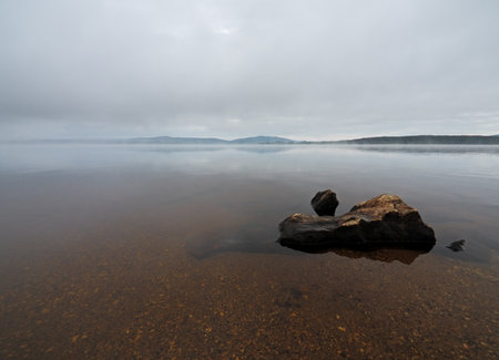 Foggy morning on the lake Lipno in the mountains Sumava, Czech Republicの写真素材