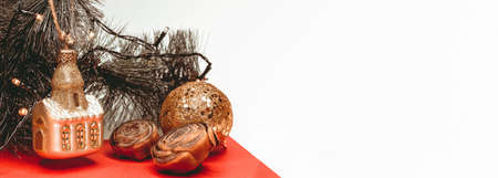 Christmas tree toy in the shape of a house on a white background, bannerの写真素材