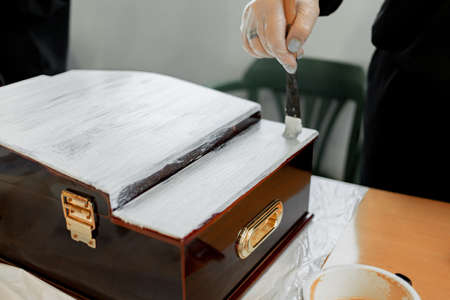 Master class on painting furniture, womens hands work with the primer brushの写真素材