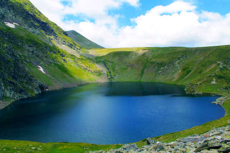 nature seven rila lakes the eye lake attraction close panoramic view spring seasonの写真素材