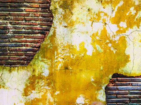 old grungy brick wall art creative vintage ancient yellow orangeの写真素材