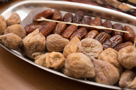 dried figs and dates on a tray