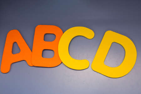 abcd on table with reflectionの写真素材