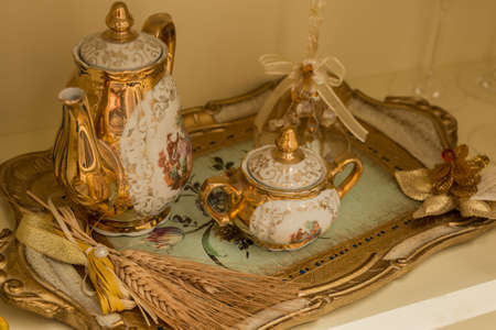 antique tea service decorated in goldの写真素材