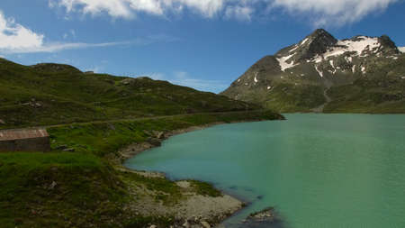 panoramic image of Bernina red train with mountains and mountains