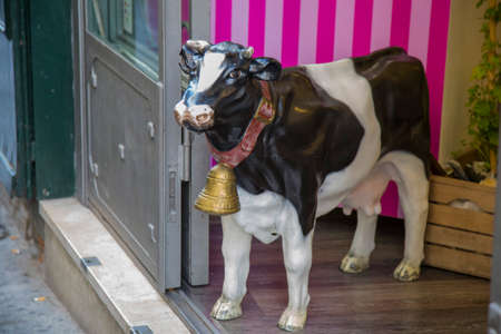 closeup of statues of cow in the store entranceの写真素材