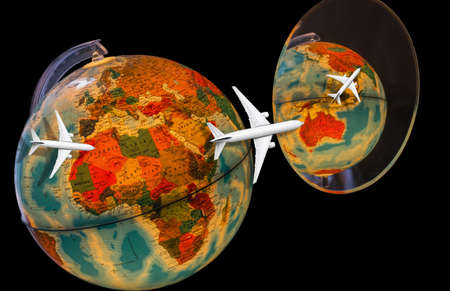 concept image with world globe reflecting in mirror and airplane flying for long journeysの写真素材