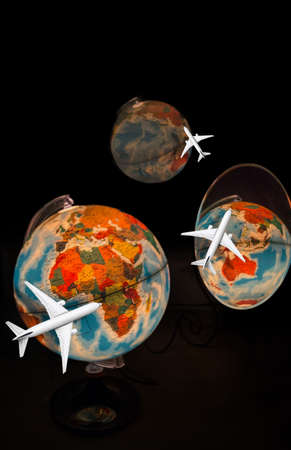 concept image with world globe reflecting in mirror and airplane flying for long journeys 2の写真素材