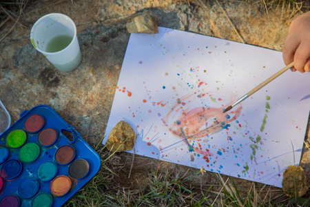 horizontal image of a kit for painting with drawing done outdoorsの写真素材