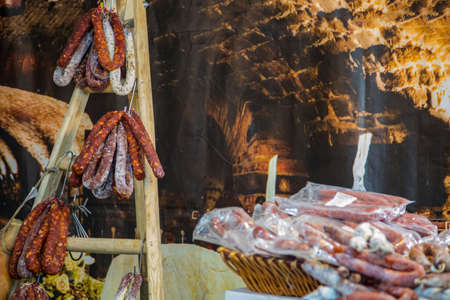 image with detail is produced typical Italian salami of wild boar and deer hangingの写真素材
