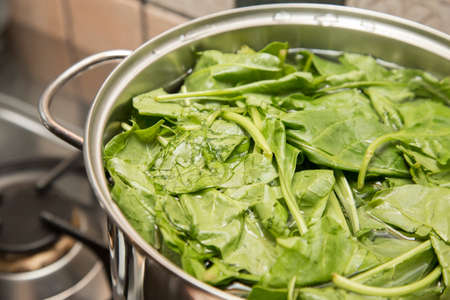 horizontal image with vegetable detail inside a pot that is about to be cooked