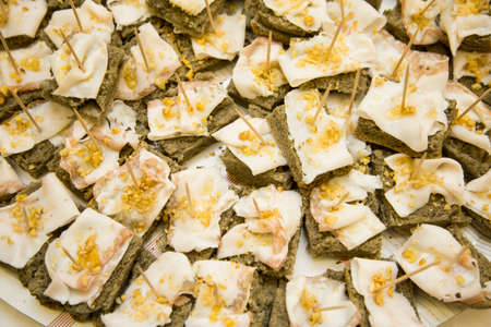 horizontal image with close detail of lard nuggets with walnuts and wholemeal bread a typical antipasto of Italian cuisineの写真素材