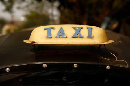 vintage Black taxi sign on the fabric roof of a Thai city Tuk-tuk in Northern Thailand, Southeast Asiaの写真素材