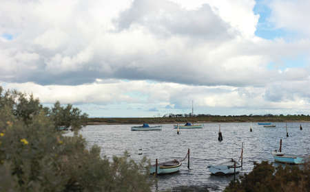 view of small fishing sail boats tide up in port in an inlet at Werribee south beach, Werribee...