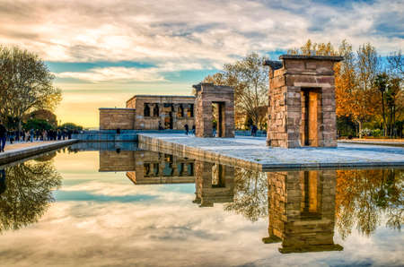 Sunset at the Debod temple in Madrid. Reflection in the water.