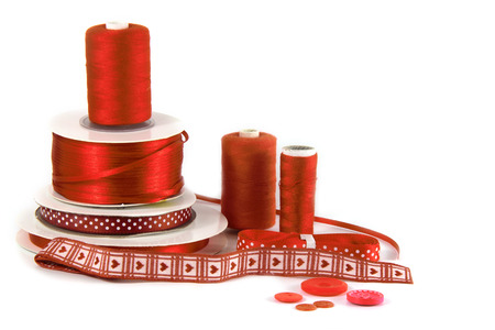 red craft, sewing and haberdashery items on white backgroundの写真素材