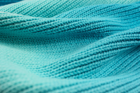 Knitted graduated turquoise shades of wool wave effect backgroundの写真素材