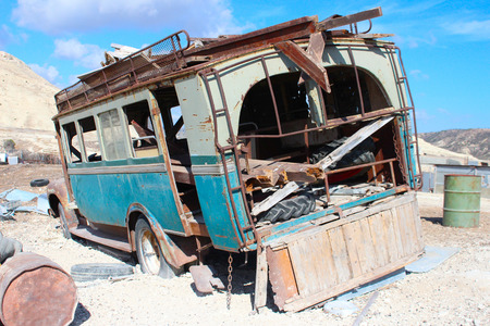 Abandoned old truck on a hillside in the sunの写真素材